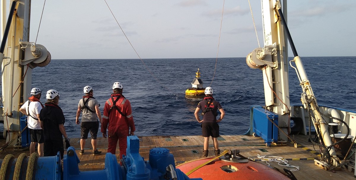 Buoy Laura is slowly dragged towards the ship Buoy Laura is slowly dragged towards the ship
