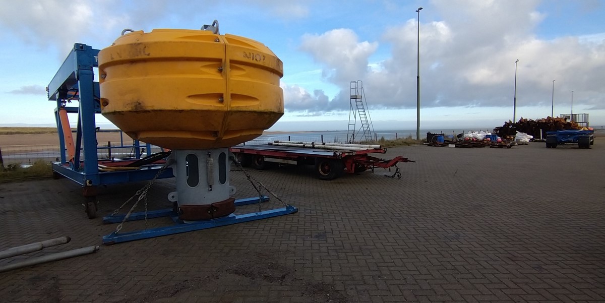 Spare buoy with freshly galvanized tube waiting on the quay of the NIOZ harbour Spare buoy with freshly galvanized tube waiting on the quay of the NIOZ harbour