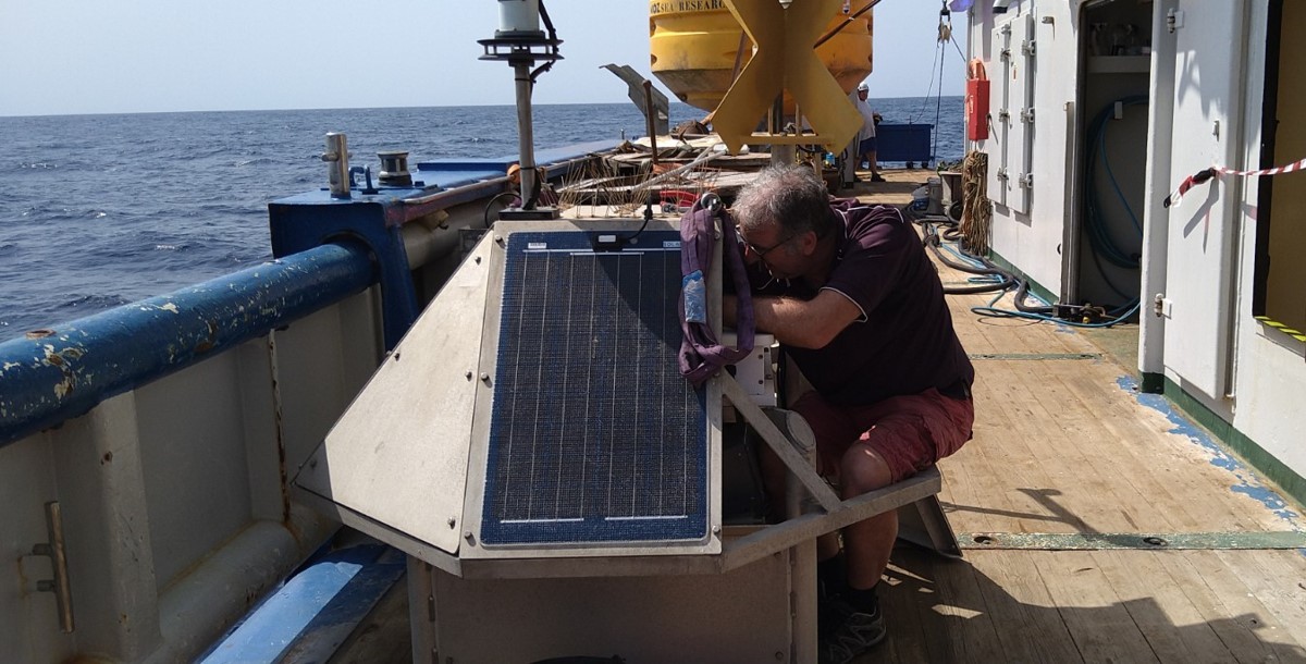 NIOZ technician Bob climbs into the buoy's mast to service it NIOZ technician Bob climbs into the buoy's mast to service it