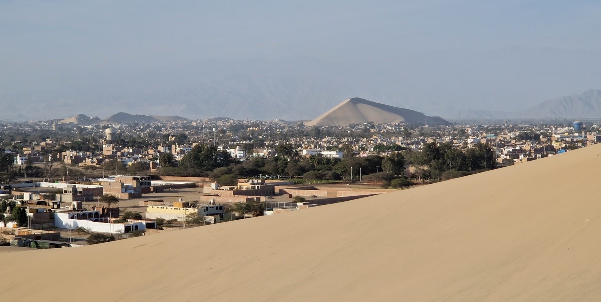 View over the city of Ica with in the distance yet another huge sand dune View over the city of Ica with in the distance yet another huge sand dune