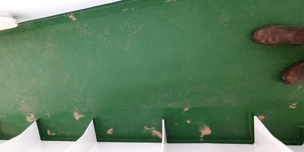 Little patches of dust washed together by rain water, boots for scale Little patches of dust washed together by rain water, boots for scale