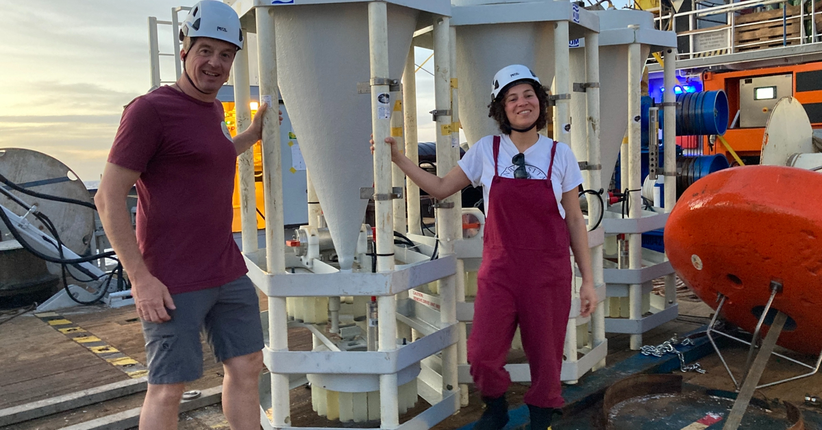 Blanda and JB next to the sediment traps which collected the samples that Blanda analysed